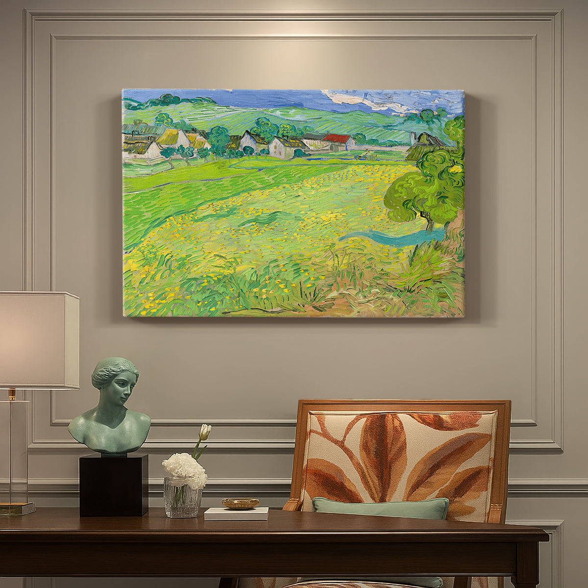 Canvas art print featuring a rolling hillside landscape with houses and fields under wide sky, presented within a refined interior setting
