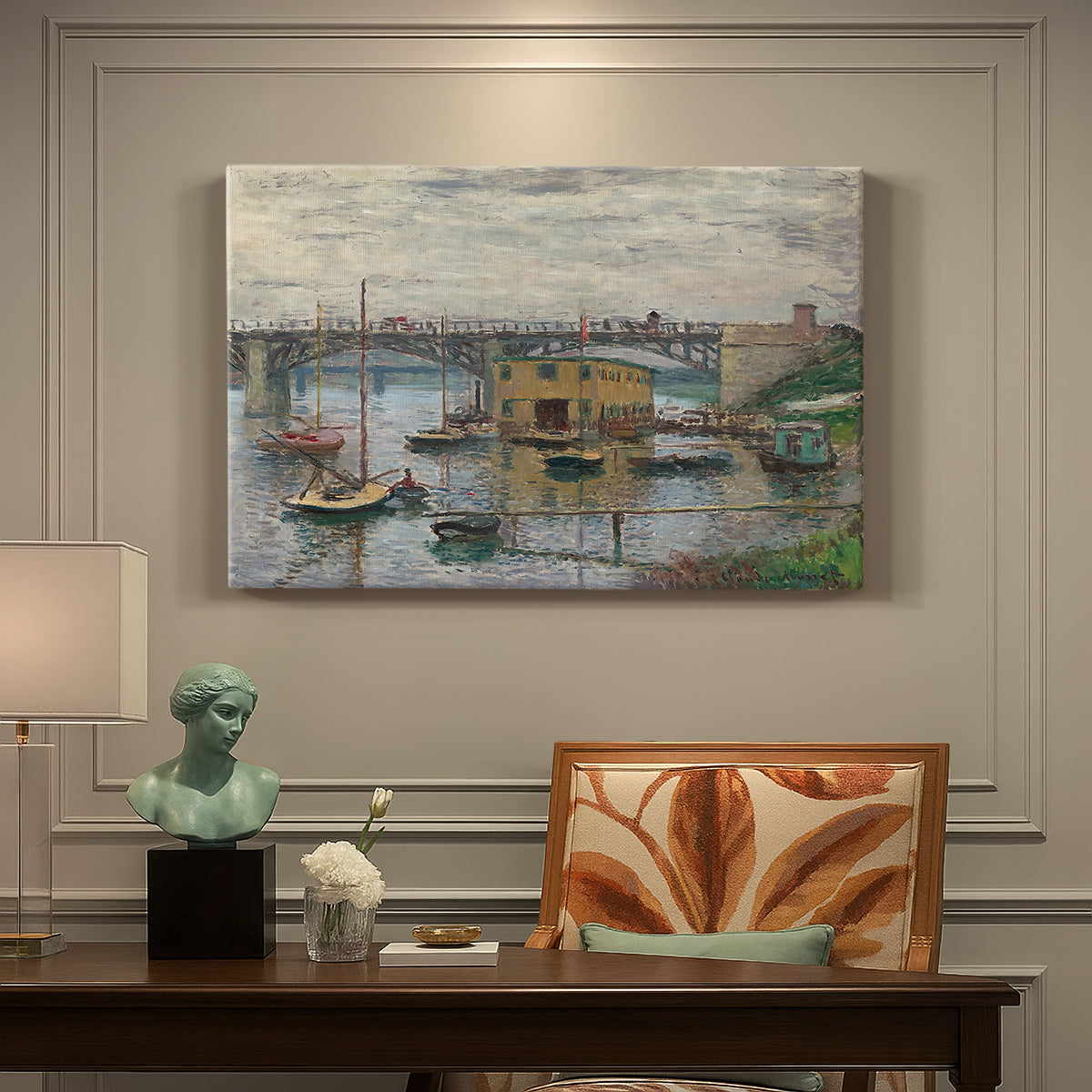 Canvas art print featuring a bridge crossing river under gray sky with muted reflections, presented within a refined interior setting