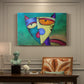 Canvas art print featuring a colorful geometric cat face with angular shapes, presented within a refined interior setting