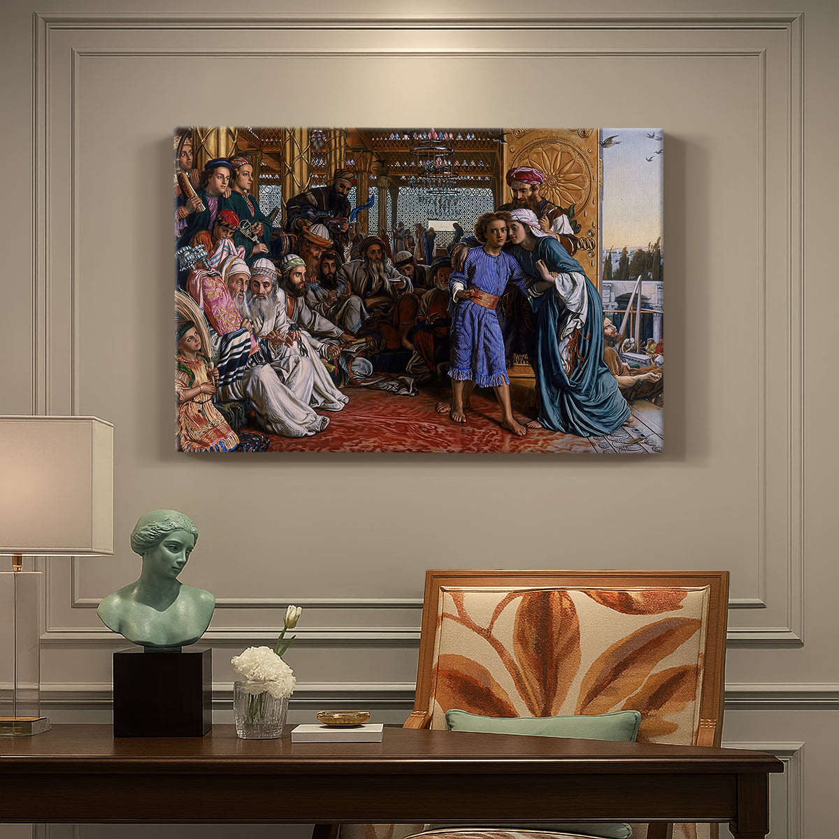 Canvas art print featuring a large group gathered in temple interior around central young figure, presented within a refined interior setting