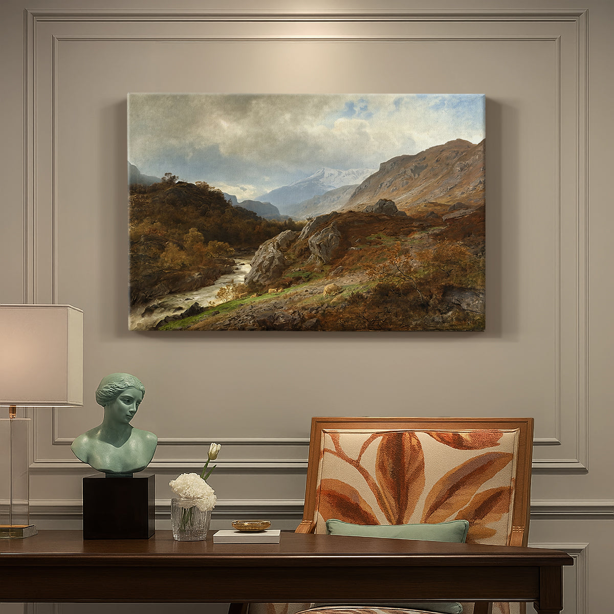 Canvas art print featuring a rugged mountain terrain with valley and distant peaks under open sky, presented within a refined interior setting