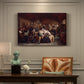 Canvas art print featuring a large gathering of villagers seated around tables during a funeral feast indoors, presented within a refined interior setting