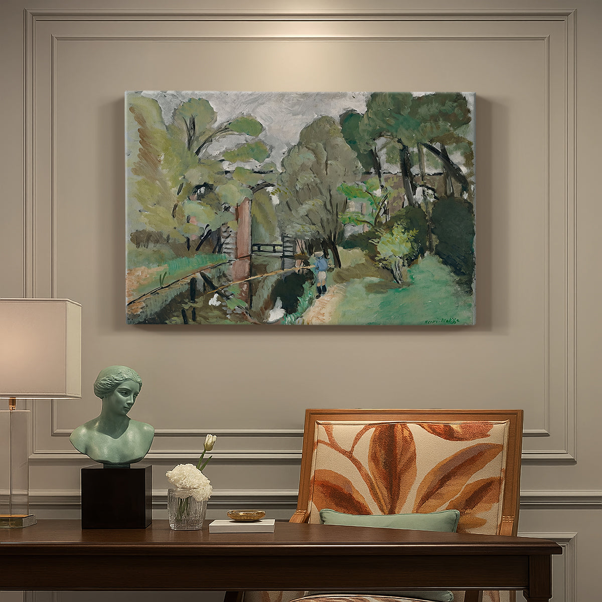 Canvas art print featuring a small figure in a green landscape near trees and buildings, presented within a refined interior setting