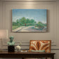 Canvas art print featuring an urban park with paths, trees, and figures under open sky, presented within a refined interior setting
