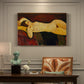 Canvas art print featuring a reclining nude woman with head turned and elongated body on draped surface, presented within a refined interior setting