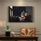 Canvas art print featuring a young woman seated at table interrupted while playing music, presented within a refined interior setting