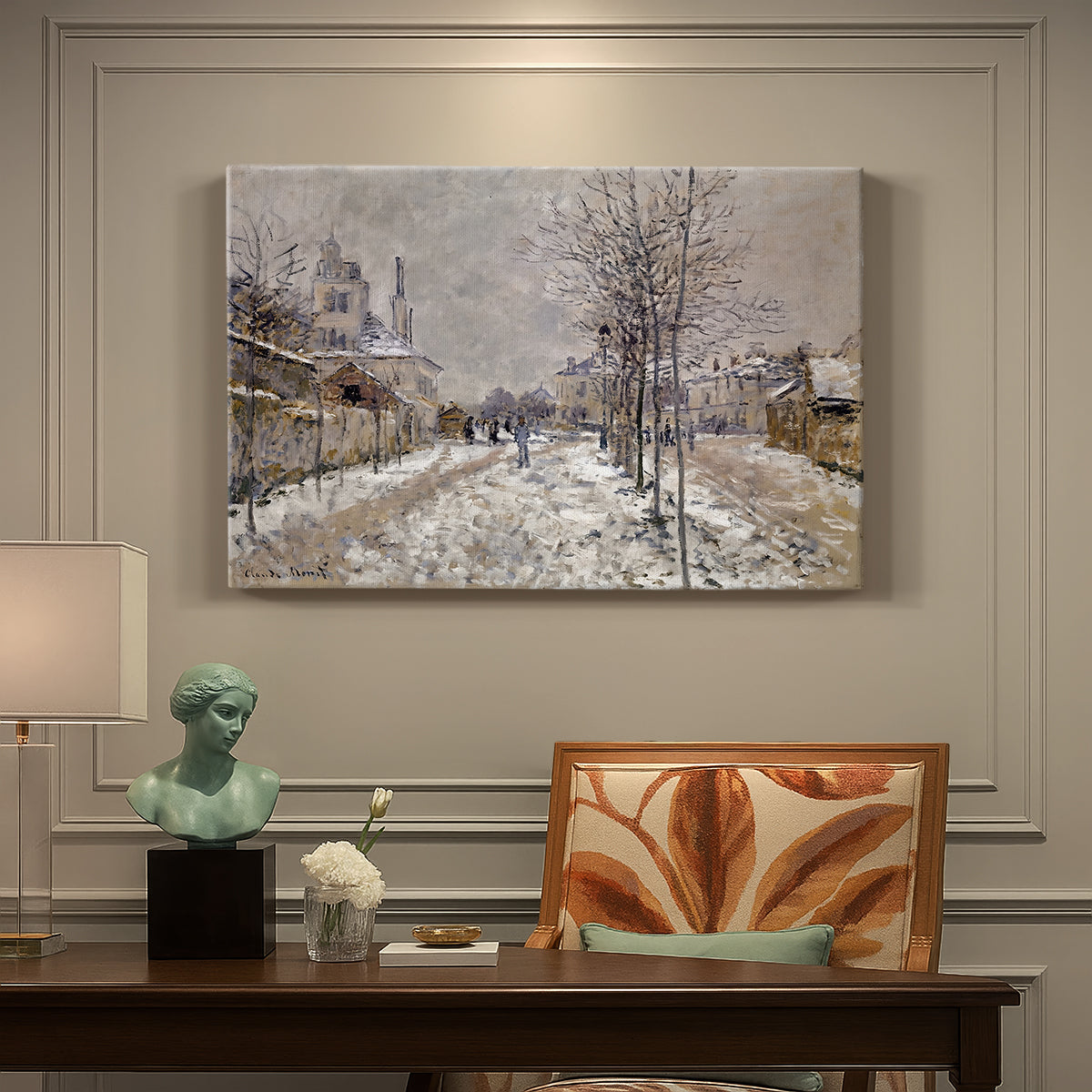Canvas art print featuring a snow-covered street lined with trees and buildings under winter sky, presented within a refined interior setting