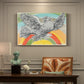Canvas art print featuring a simplified dove in flight above rainbow arc, presented within a refined interior setting