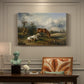 Canvas art print featuring two horses grazing in open pasture, presented within a refined interior setting