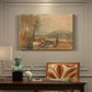 Canvas art print featuring a castle surrounded by open landscape under sky, presented within a refined interior setting