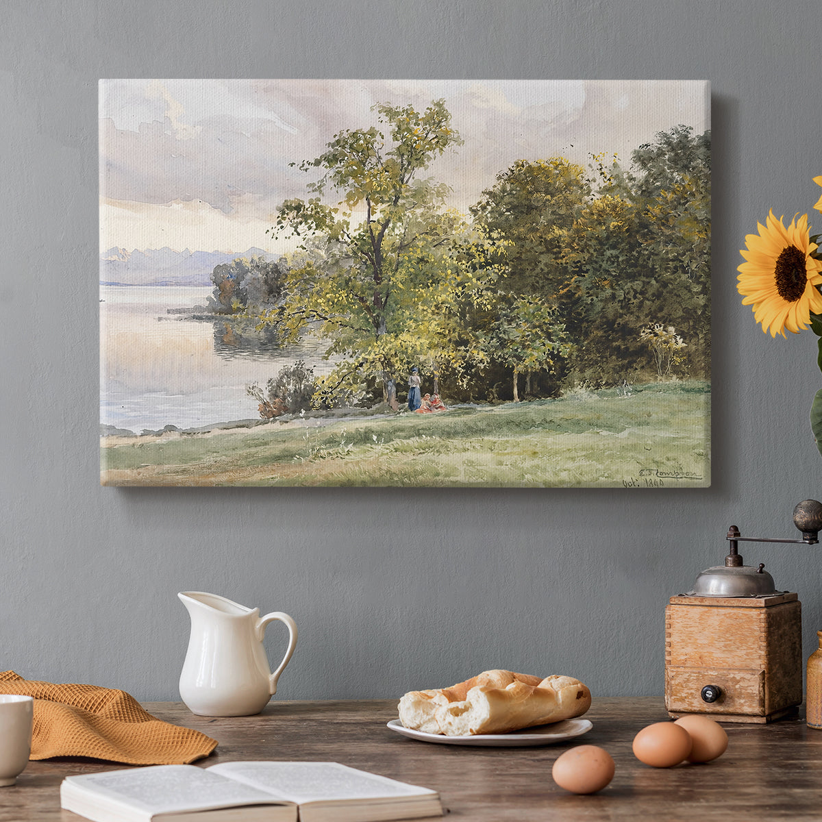 Canvas art print featuring a lakeside landscape with calm water and trees along shoreline, set in a cozy kitchen setting