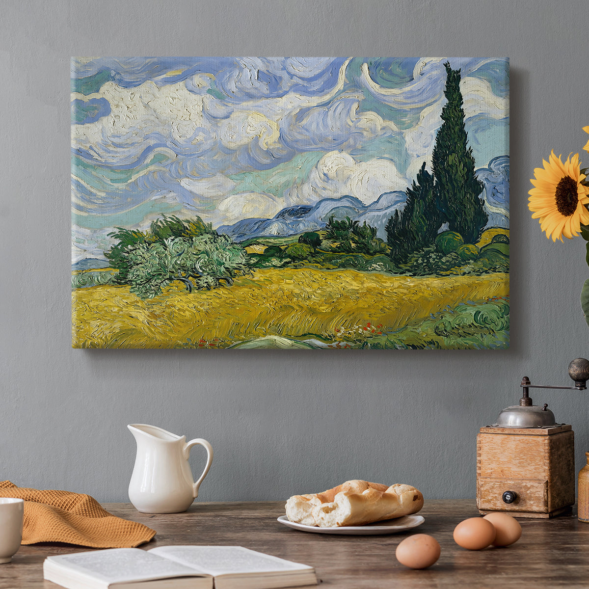 Canvas art print featuring a golden wheat field with tall cypress trees under swirling sky, set in a cozy kitchen setting