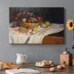 Canvas art print featuring an arrangement of apples and grapes on table with soft natural light, set in a cozy kitchen setting