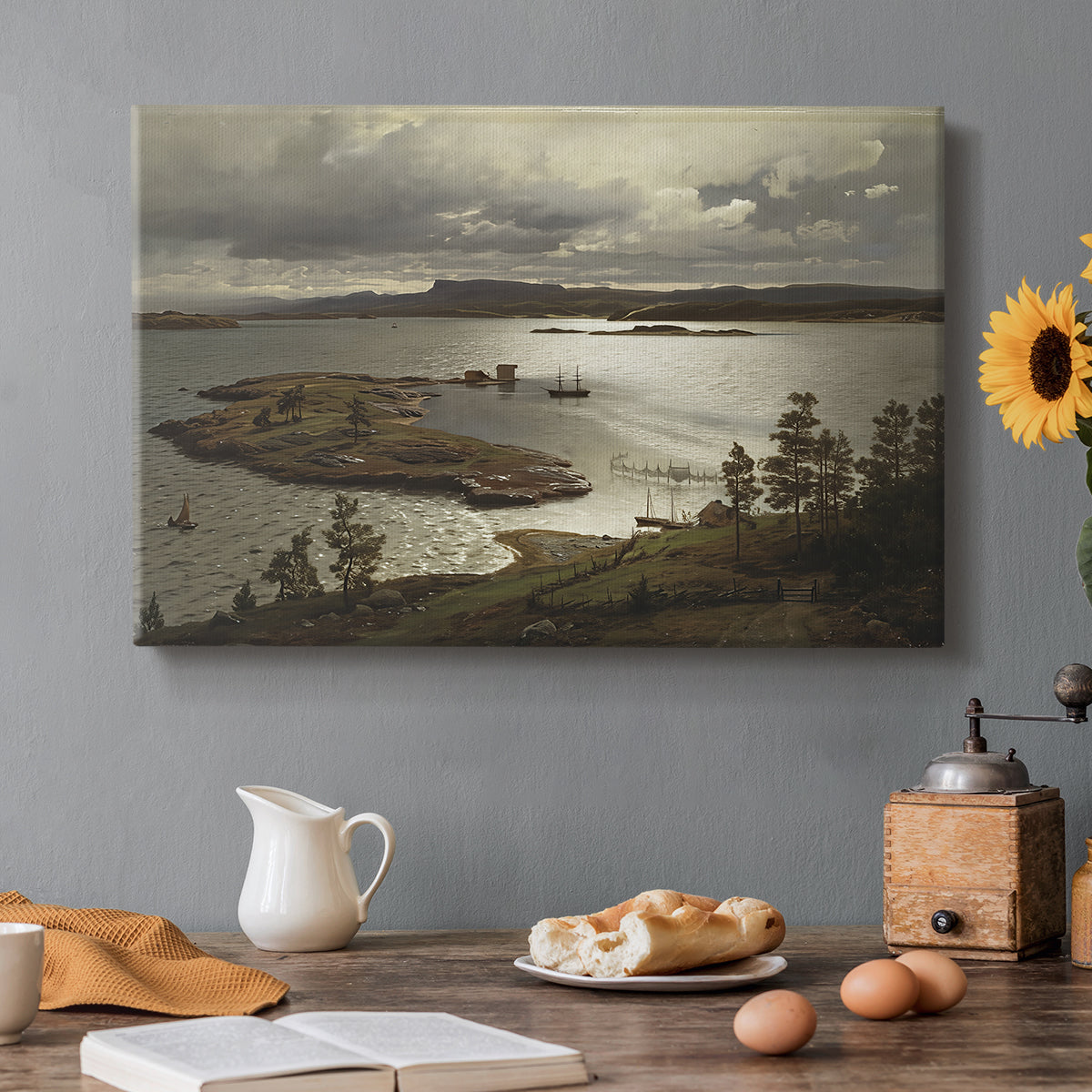Canvas art print featuring a fjord landscape with water, shoreline, and distant hills under soft sky, set in a cozy kitchen setting