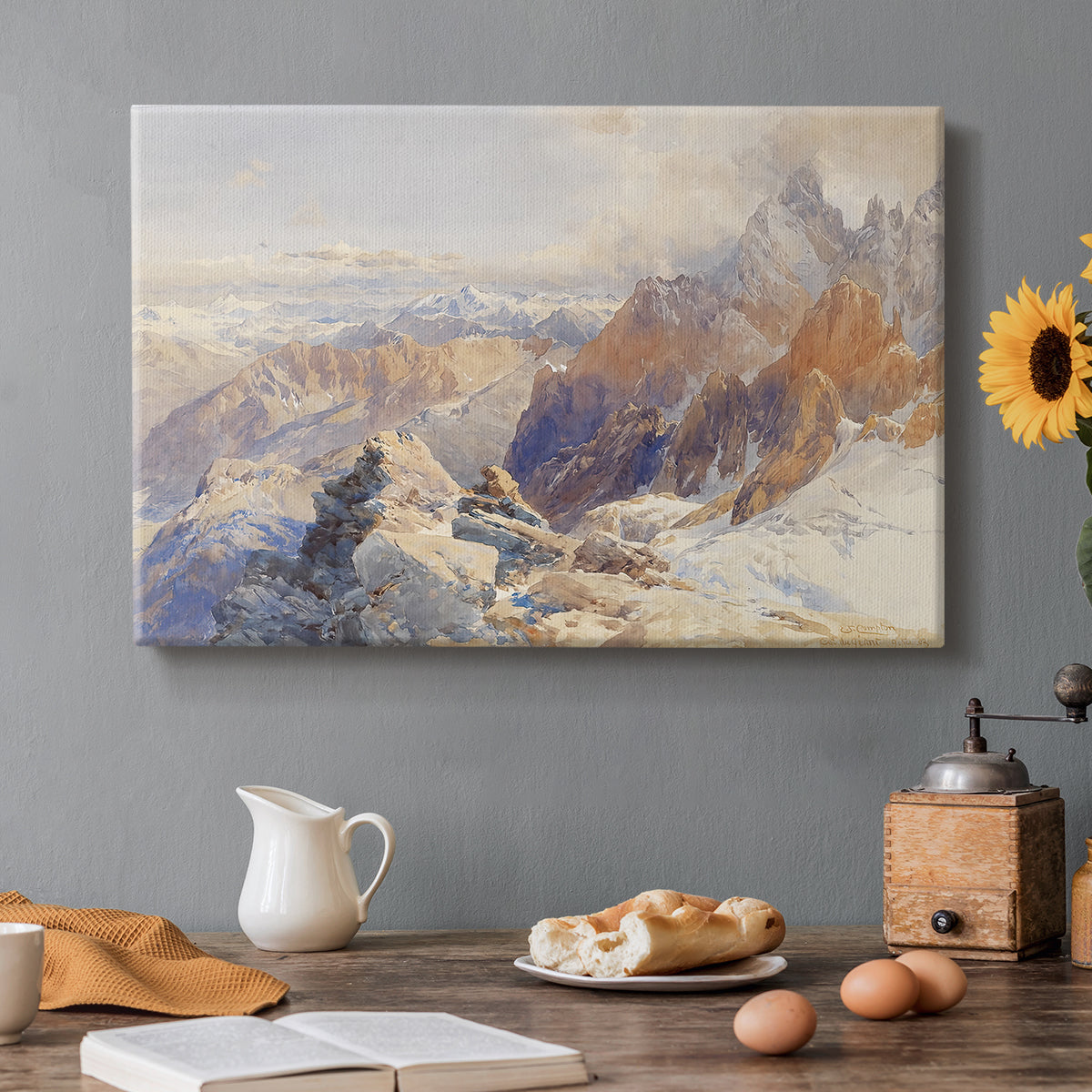 Canvas art print featuring a mountain pass with snow-covered peaks and expansive alpine valley, set in a cozy kitchen setting
