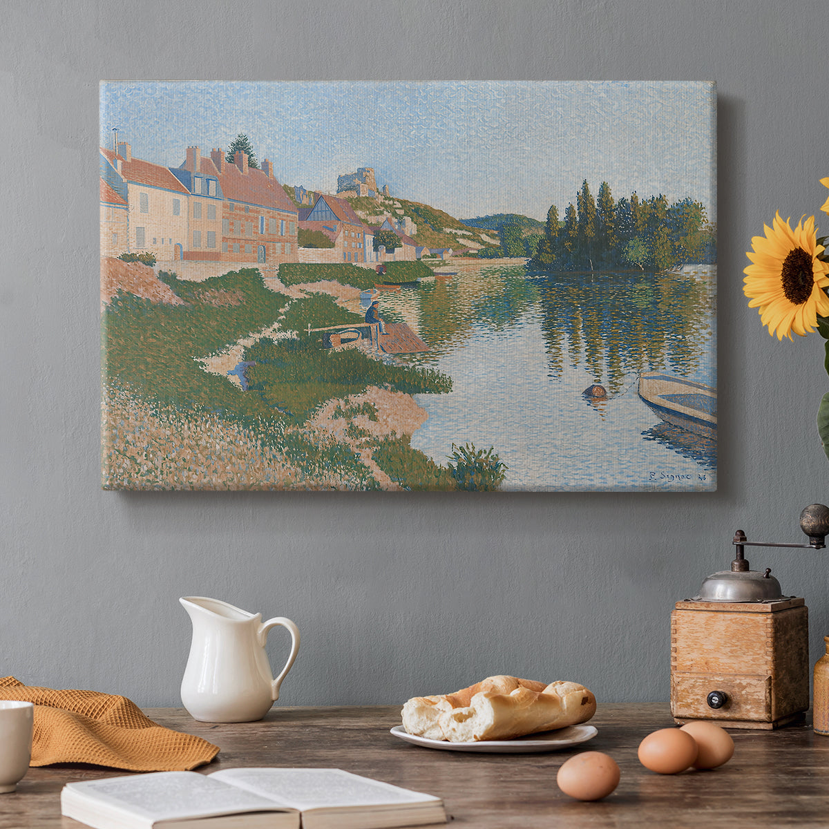 Canvas art print featuring a hillside town overlooking river with buildings and terrain, set in a cozy kitchen setting