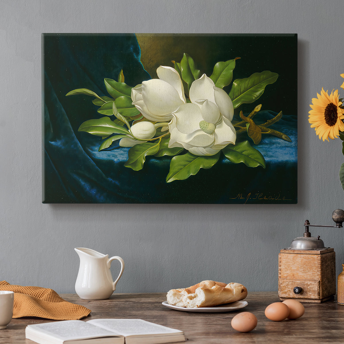 Canvas art print featuring a large magnolia flowers arranged on blue velvet, set in a cozy kitchen setting