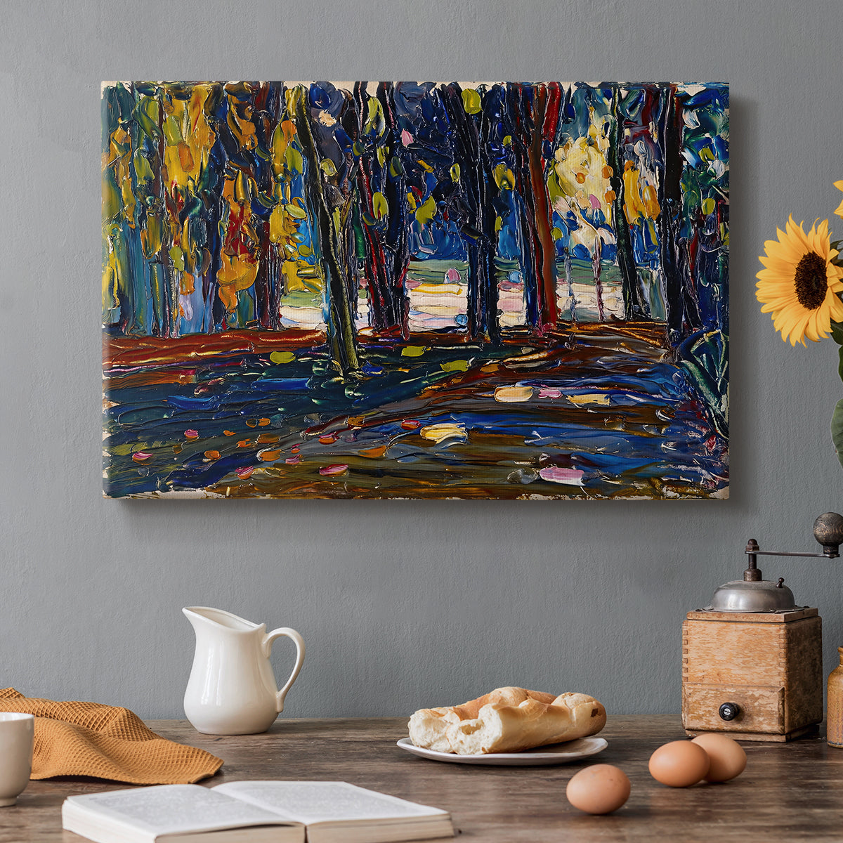 Canvas art print featuring an abstracted landscape with trees and foliage in warm autumn tones, set in a cozy kitchen setting
