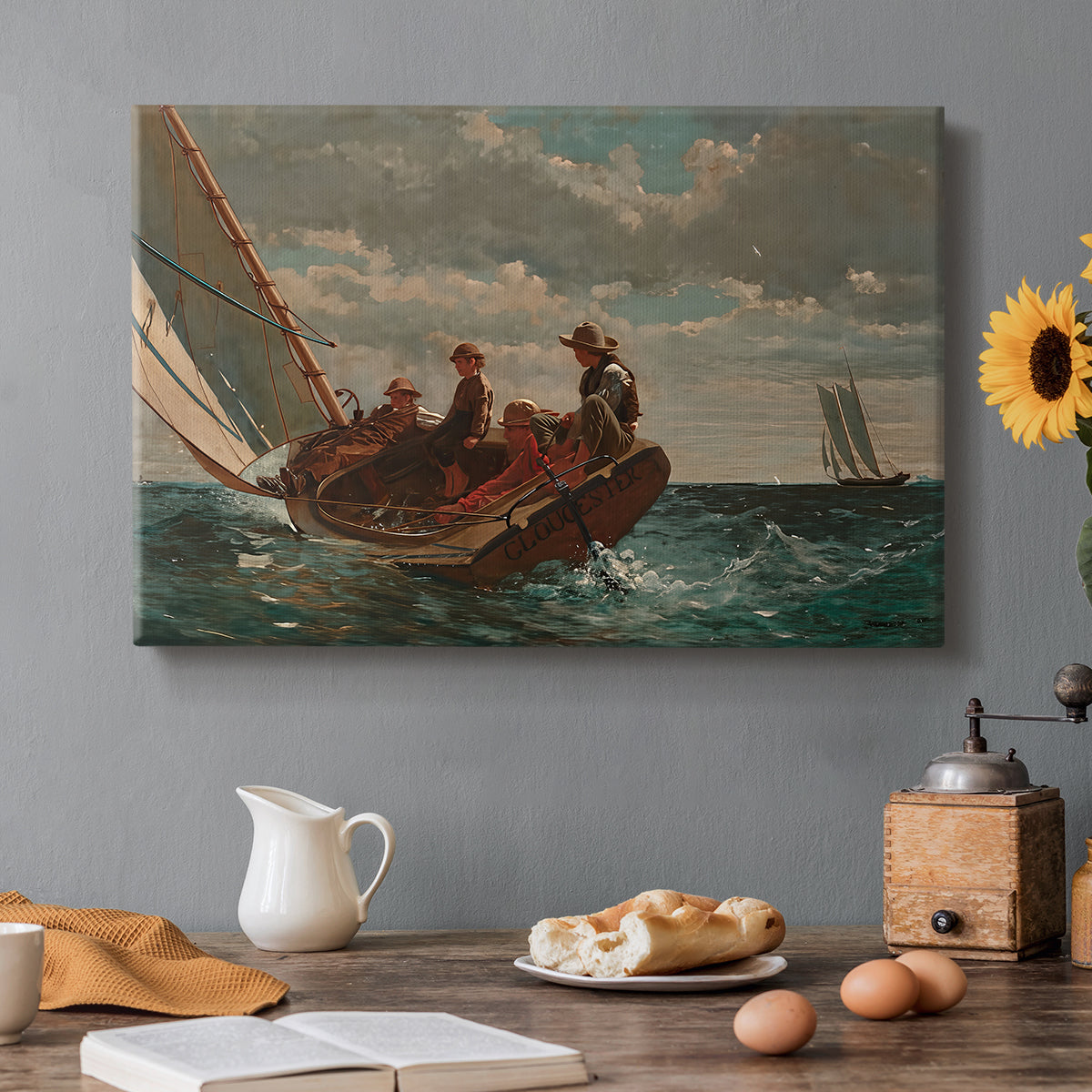 Canvas art print featuring a small sailboat with boys aboard leaning into wind on open water, set in a cozy kitchen setting