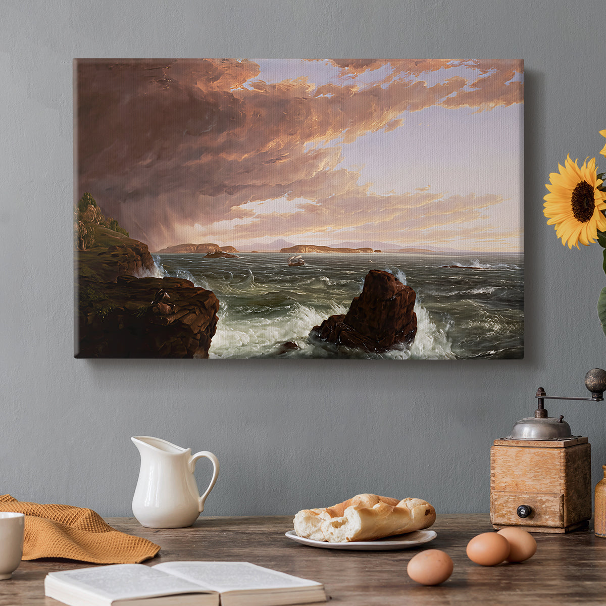 Canvas art print featuring a coastal landscape with water and sky clearing after storm, set in a cozy kitchen setting