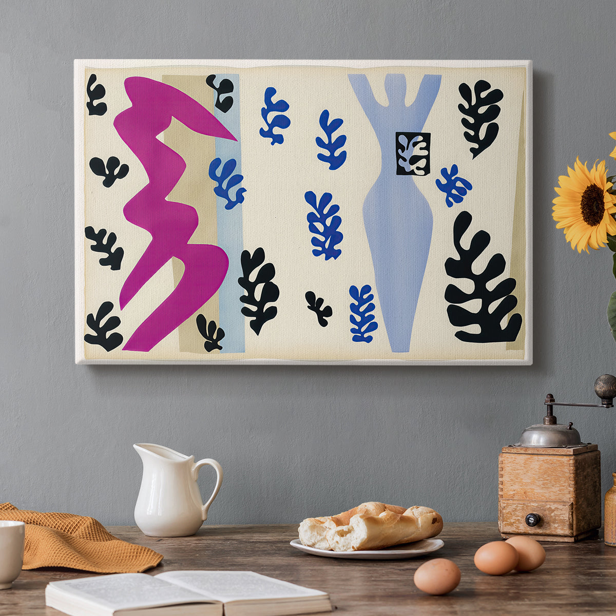 Canvas art print featuring an abstract cut-out composition suggesting a knife thrower, set in a cozy kitchen setting