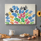 Canvas art print featuring an abstract arrangement of colorful leaf-like cut-outs, set in a cozy kitchen setting