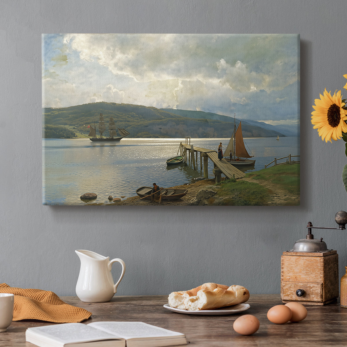 Canvas art print featuring a wooden jetty extending into calm water with boats nearby, set in a cozy kitchen setting