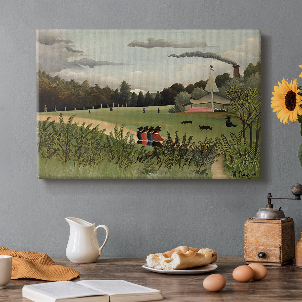 Canvas art print featuring an industrial factory building with figures working in outdoor setting, set in a cozy kitchen setting