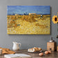 Canvas art print featuring stacked bundles of wheat arranged across harvested field under open sky, set in a cozy kitchen setting