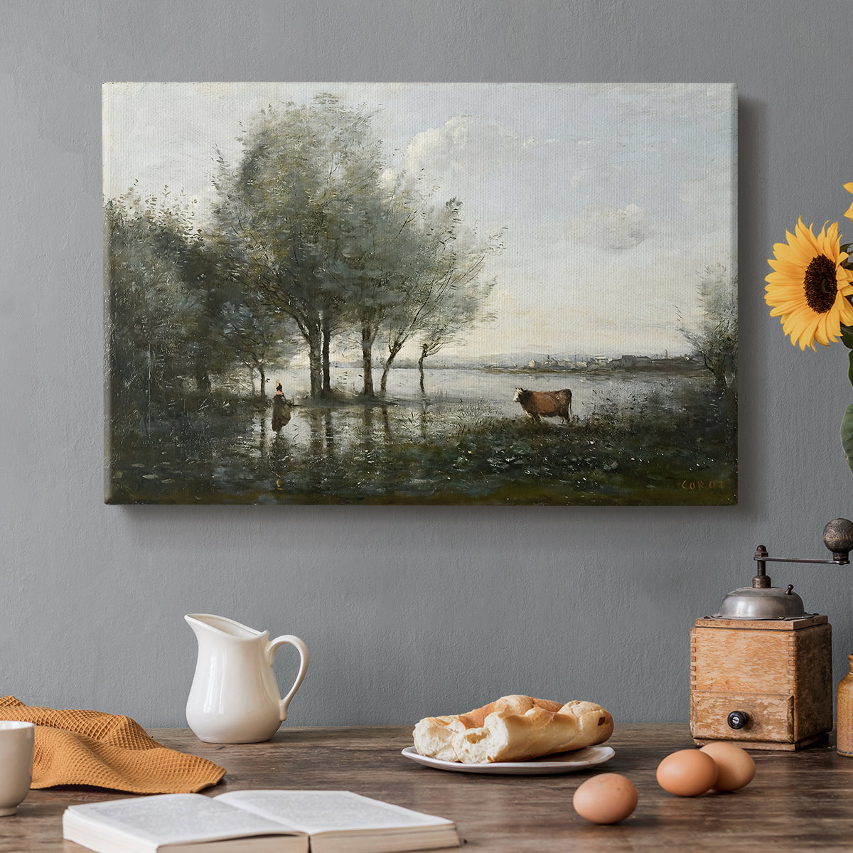 Canvas art print featuring a marshy landscape with water, trees, and soft atmospheric light, set in a cozy kitchen setting