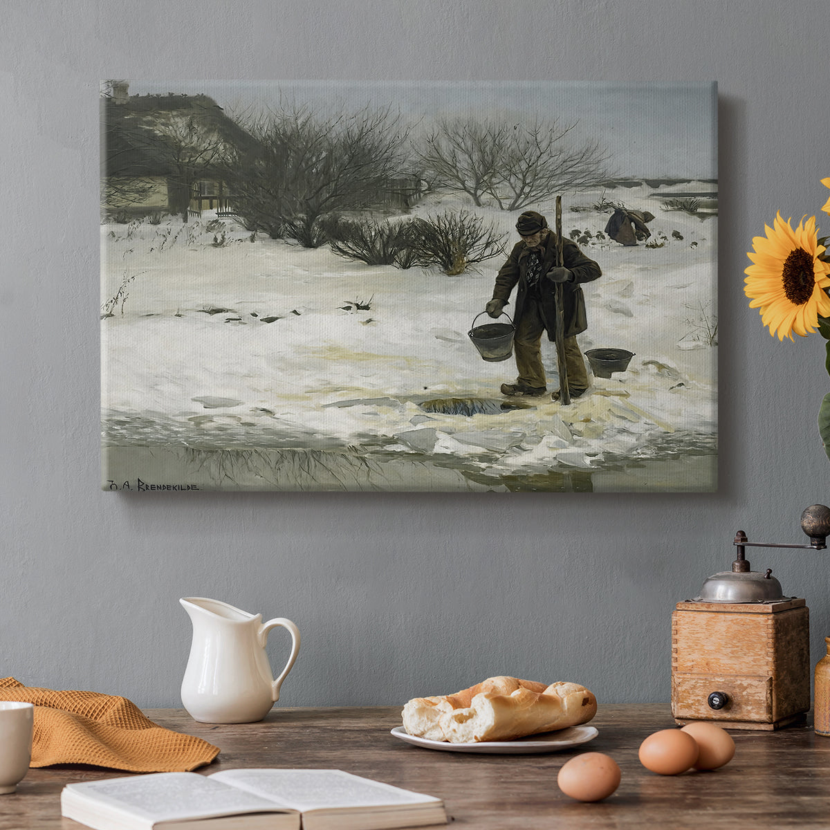 Canvas art print featuring figures walking along snowy path in winter landscape with wind and cold atmosphere, set in a cozy kitchen setting