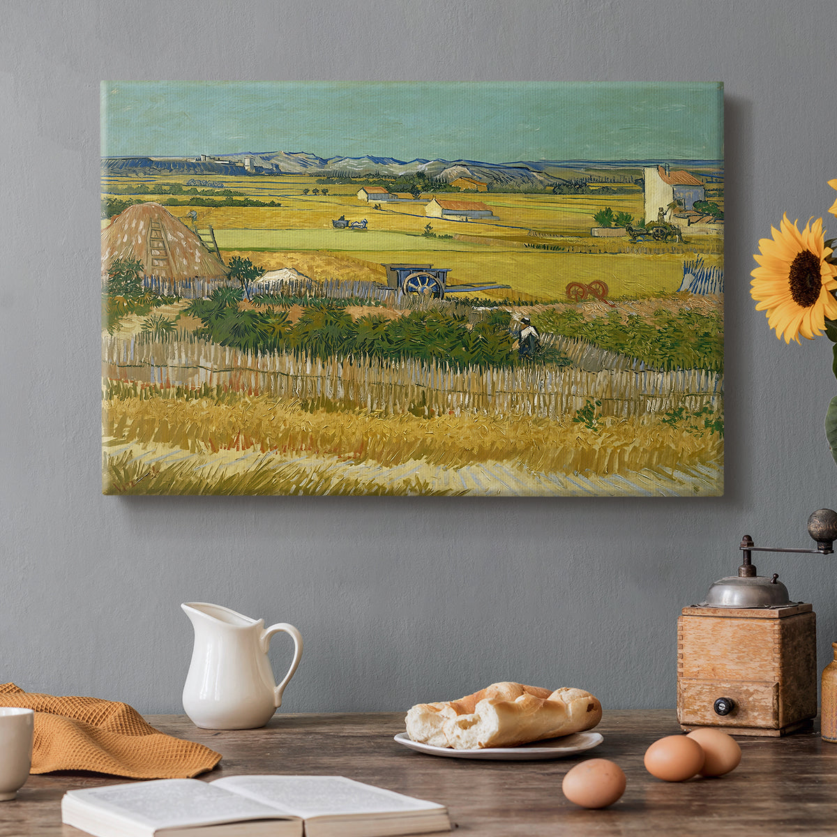 Canvas art print featuring an expansive farmland with workers harvesting crops under bright sky, set in a cozy kitchen setting