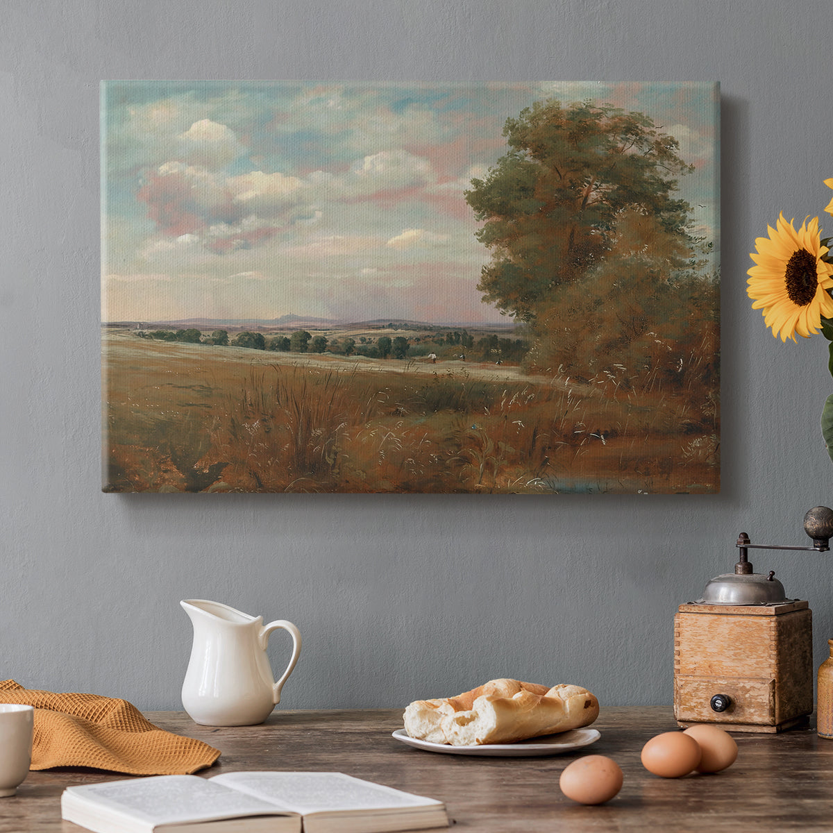 Canvas art print featuring a wide landscape with distant buildings across terrain, set in a cozy kitchen setting