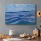 Canvas art print featuring coastal dunes and water in horizontal color bands, set in a cozy kitchen setting