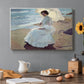 Canvas art print featuring a woman seated on beach in flowing white dress beside water, set in a cozy kitchen setting