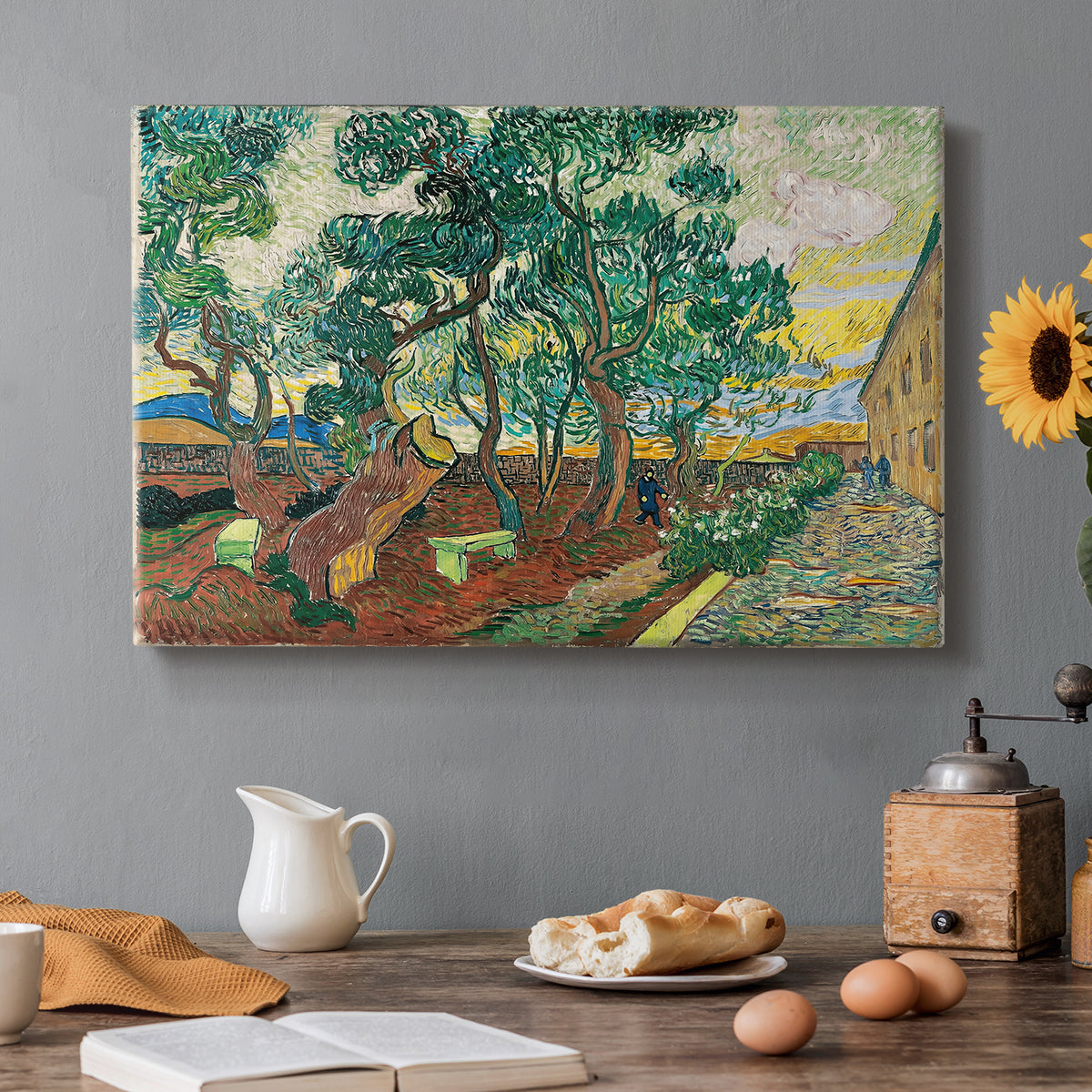 Canvas art print featuring an enclosed garden with trees and pathways rendered in vibrant brushwork, set in a cozy kitchen setting