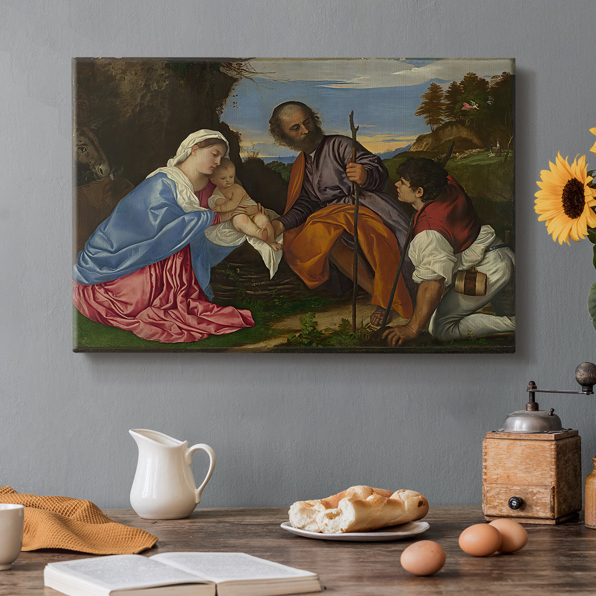Canvas art print featuring a holy family gathered with shepherd in rustic outdoor setting, set in a cozy kitchen setting