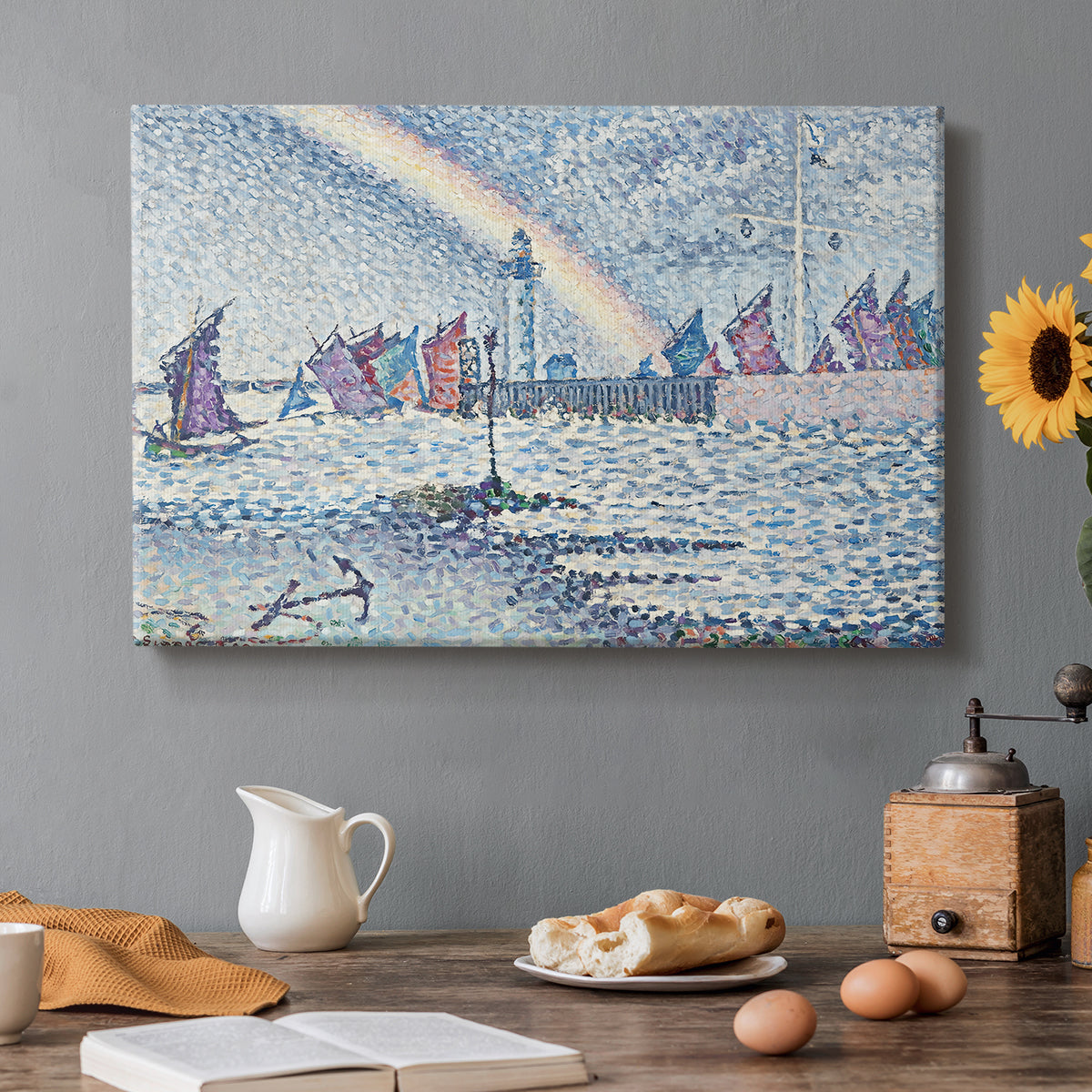 Canvas art print featuring boats entering harbor with buildings, set in a cozy kitchen setting