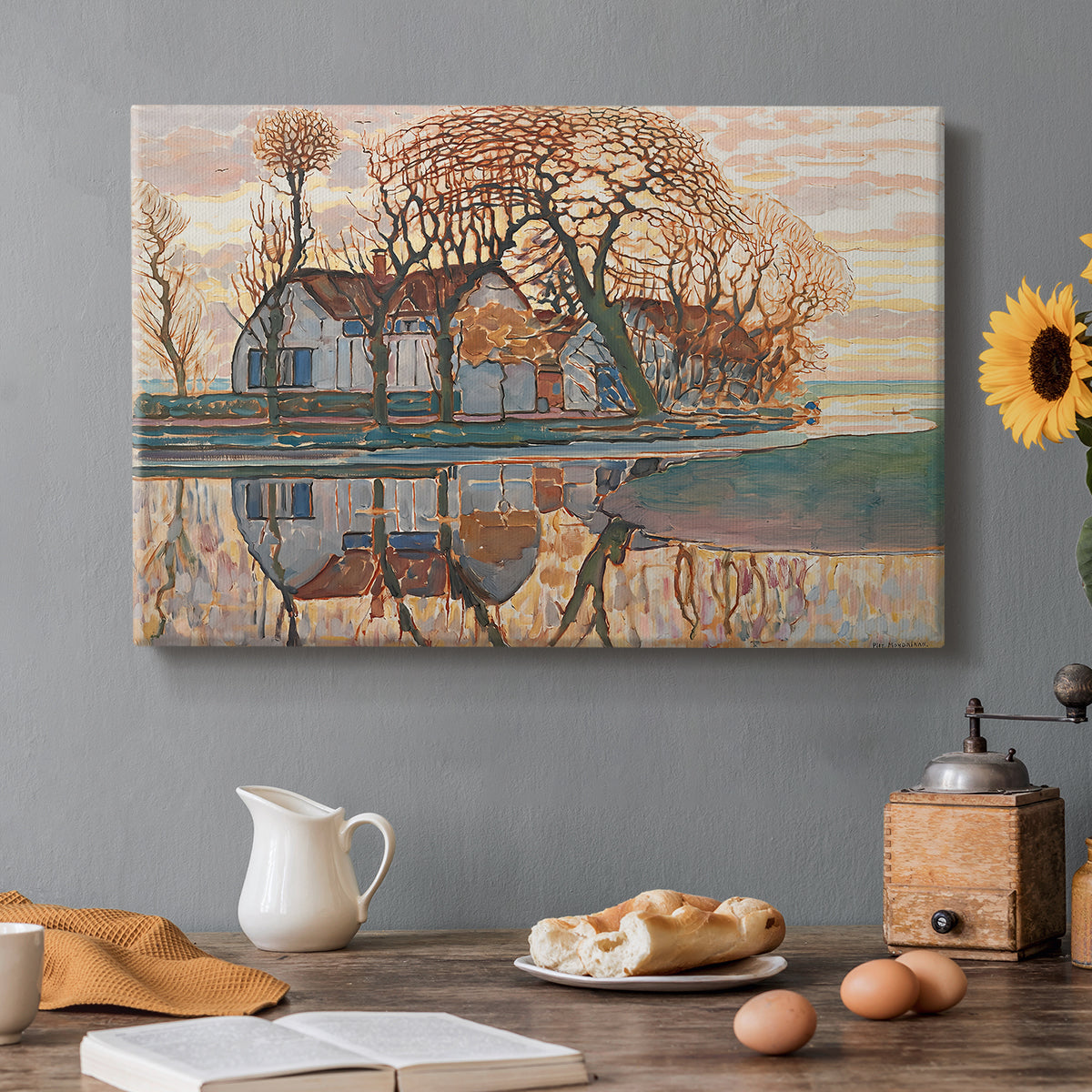 Canvas art print featuring a farmhouse in simplified landscape with bold outlines, set in a cozy kitchen setting