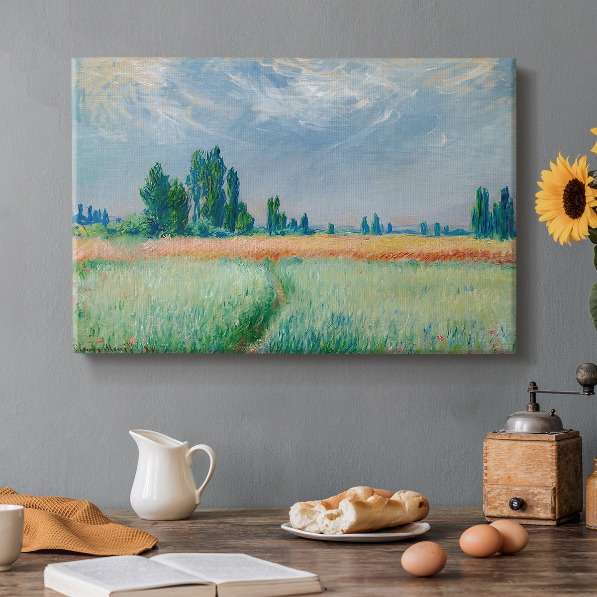 Canvas art print featuring a golden wheat field stretching across landscape under soft sky, set in a cozy kitchen setting