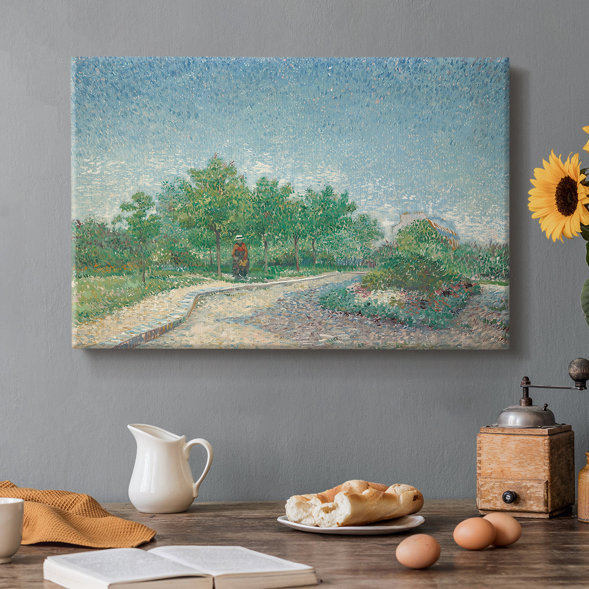 Canvas art print featuring an urban park with paths, trees, and figures under open sky, set in a cozy kitchen setting