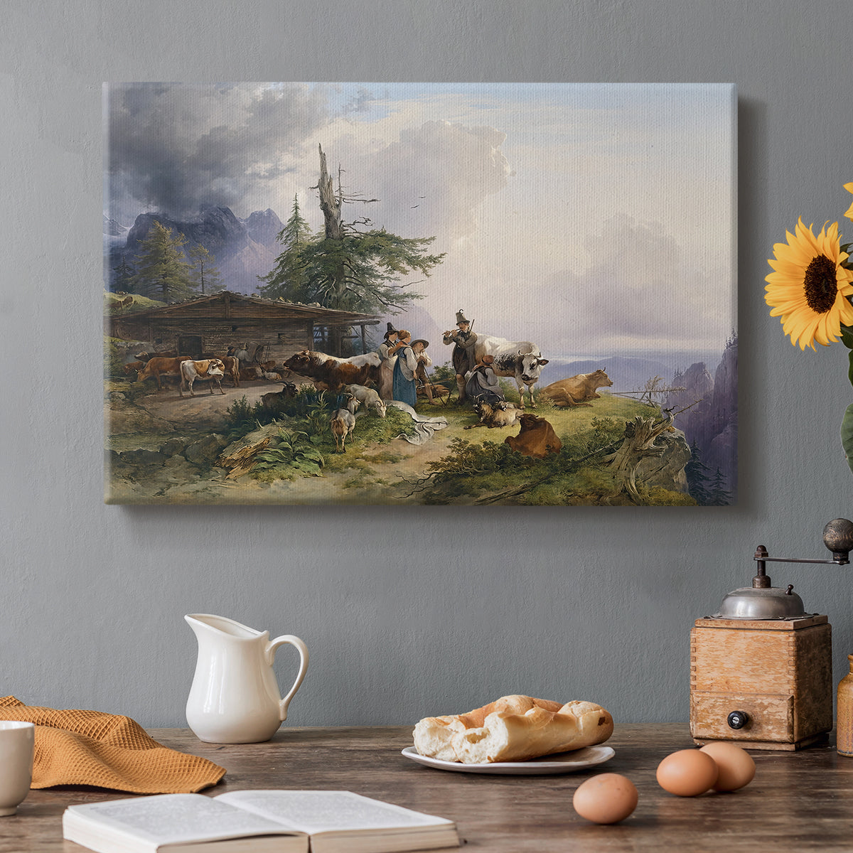 Canvas art print featuring a farmhouse with livestock set within mountainous alpine landscape, set in a cozy kitchen setting
