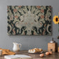 Canvas art print featuring a dense repeating pattern with animals, plants, and decorative elements across fabric, set in a cozy kitchen setting