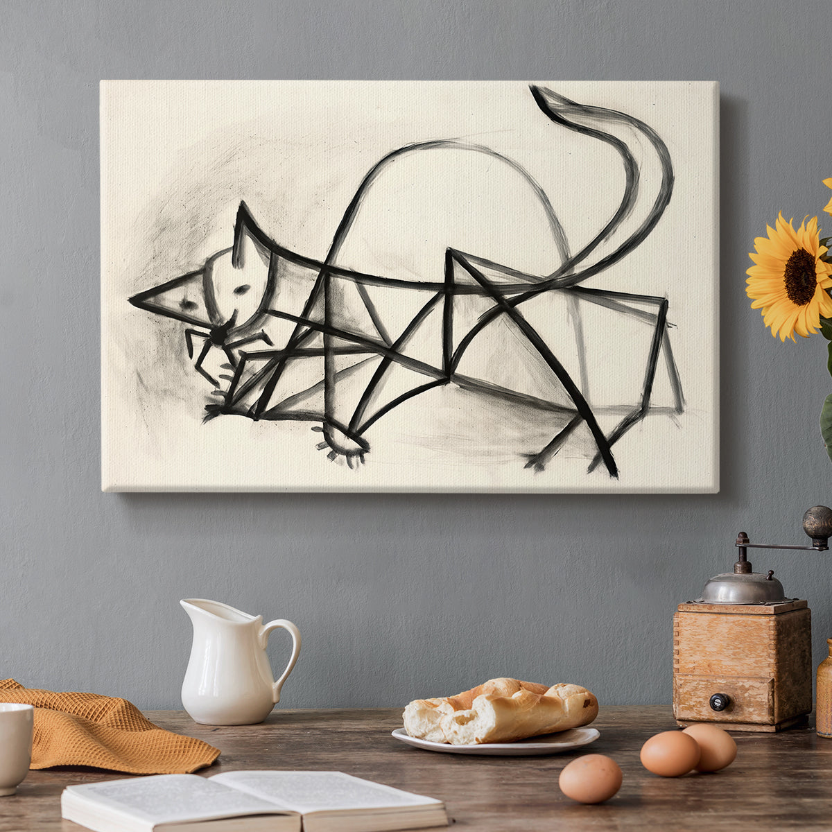Canvas art print featuring a simplified line drawing of cat using loose strokes, set in a cozy kitchen setting