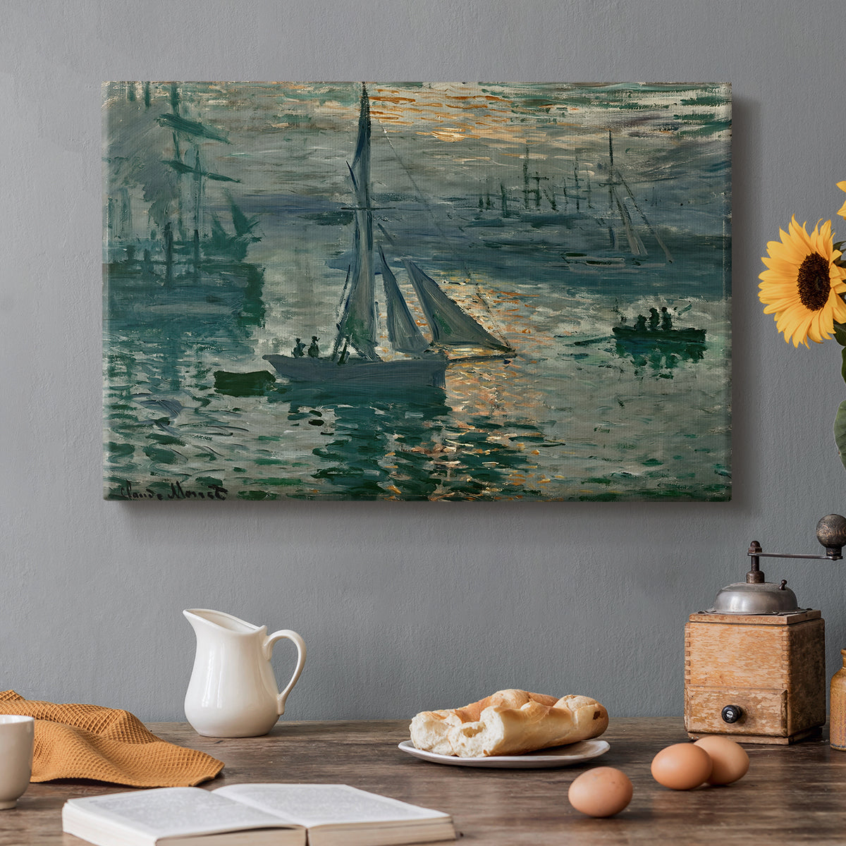 Canvas art print featuring a hazy sunrise over harbor with boats silhouetted in soft morning light, set in a cozy kitchen setting