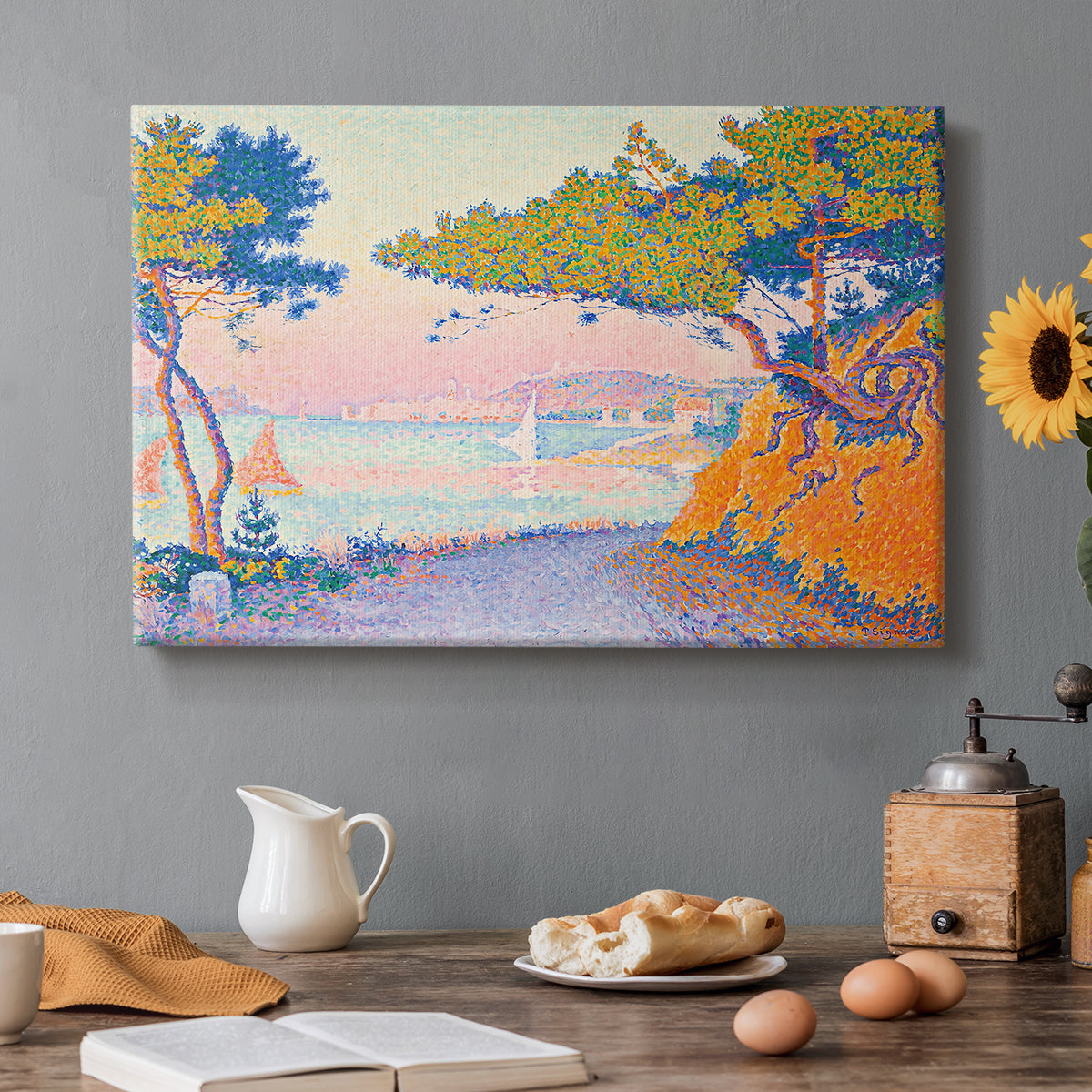 Canvas art print featuring a coastal landscape with trees and water, set in a cozy kitchen setting
