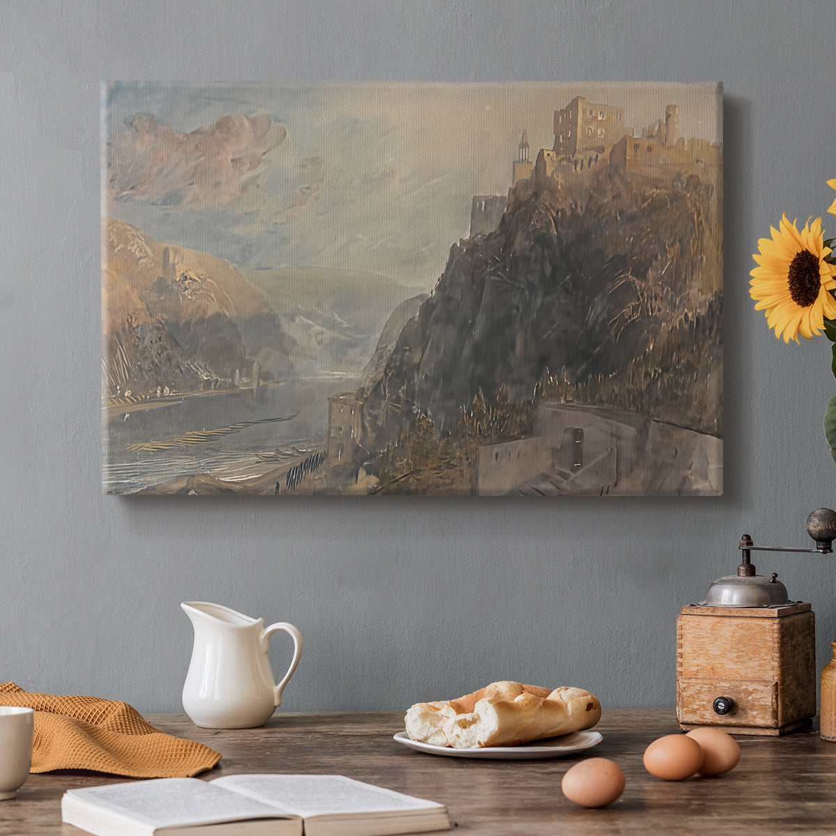 Canvas art print featuring a river landscape with castles along steep terrain, set in a cozy kitchen setting