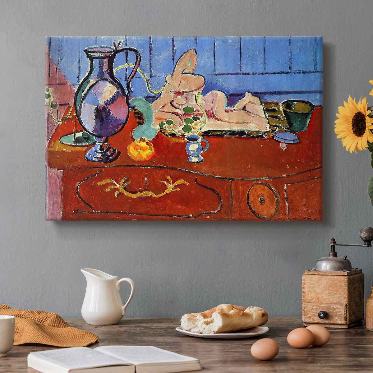 Canvas art print featuring a still life with pewter jug and pink statuette on a patterned table, set in a cozy kitchen setting