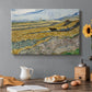 Canvas art print featuring a ploughed field enclosed by low walls with lone worker under broad sky, set in a cozy kitchen setting
