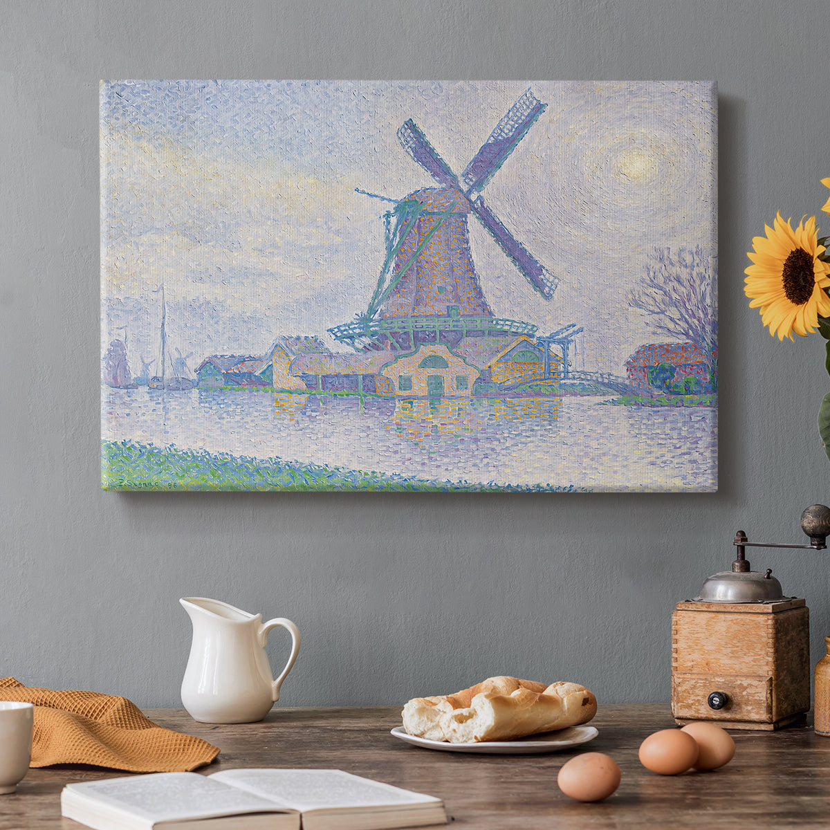 Canvas art print featuring a windmill beside water in quiet town landscape, set in a cozy kitchen setting